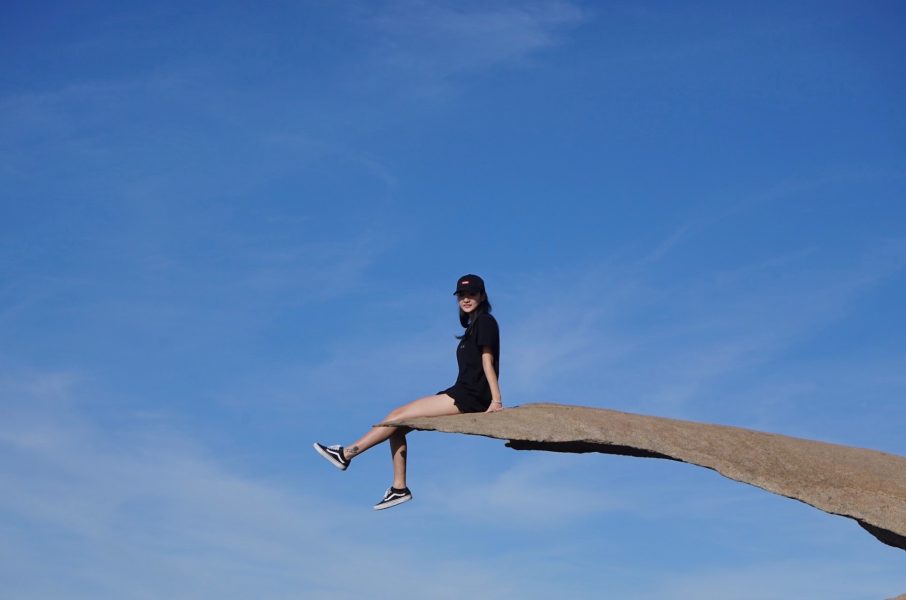 Laraine sitting on a ledge